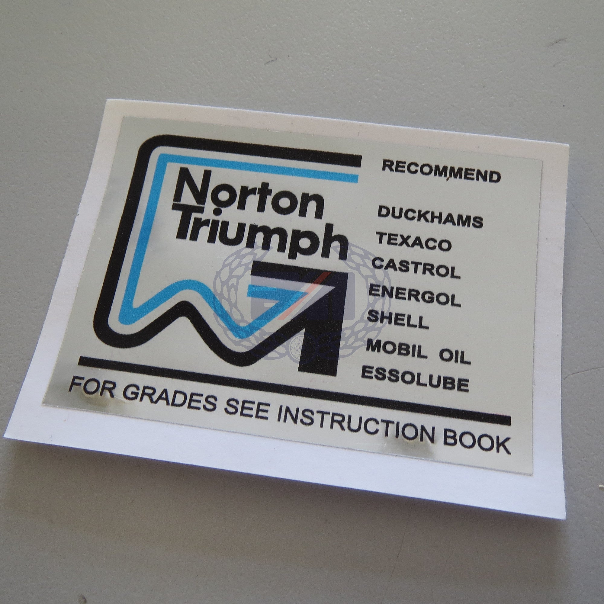 DECAL "NORTON-TRIUMPH OILS"   (Chrome with gloss laminate)