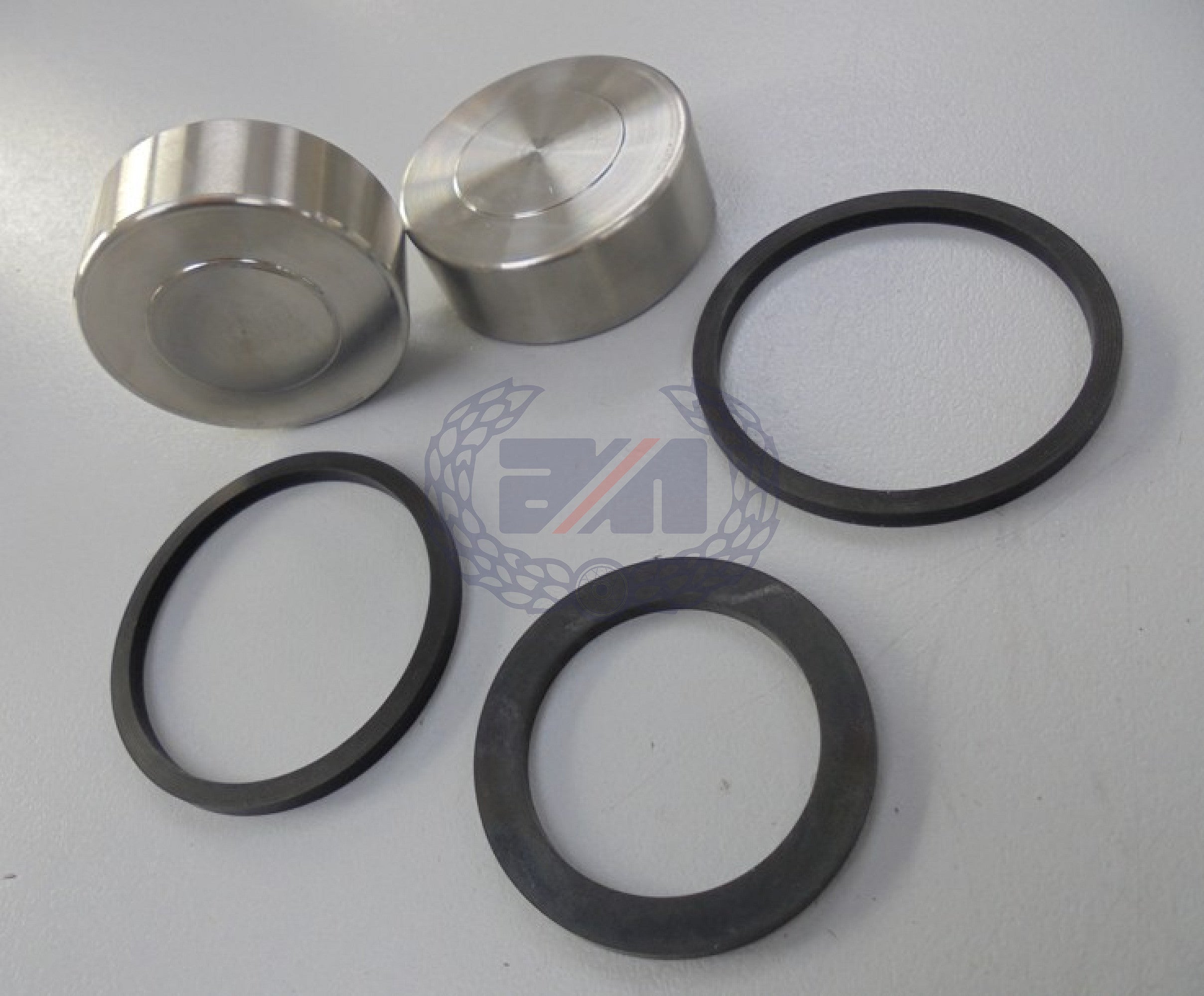 DISC BRAKE CALIPER OVERHAUL KIT: two stainless steel pistons and three seals